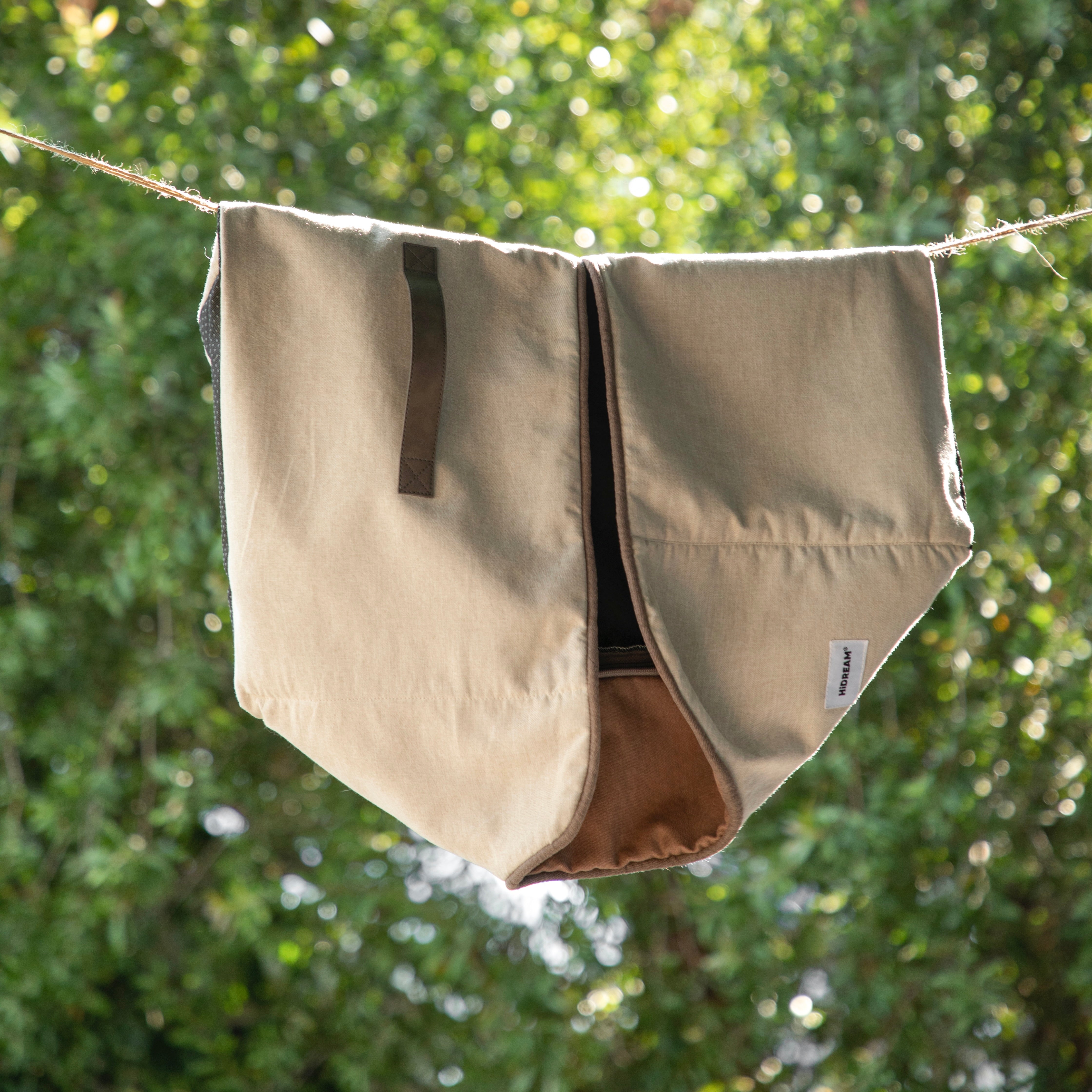 HiDREAM Four-Season Pet Bed cover hanging outdoors. Durable, washable fabric ideal for easy maintenance and long-term use.