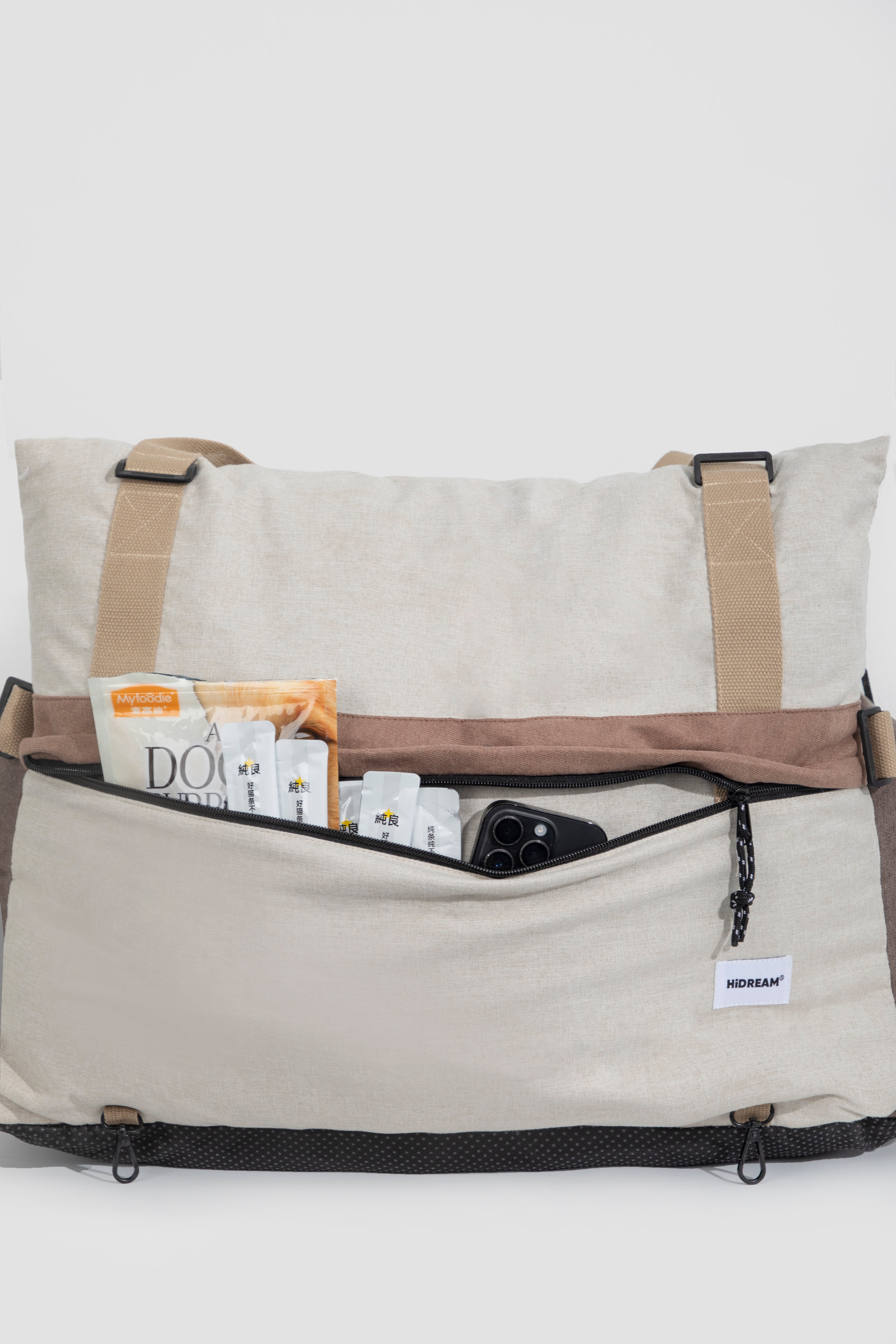 Back pocket of HiDREAM Dog & Cat Car Safety Seat with pet supplies. Convenient storage for travel essentials.