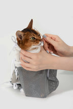 HiDREAM Cat Bathing Bag securing a cat during face grooming, showing ease of access and gentle restraint.