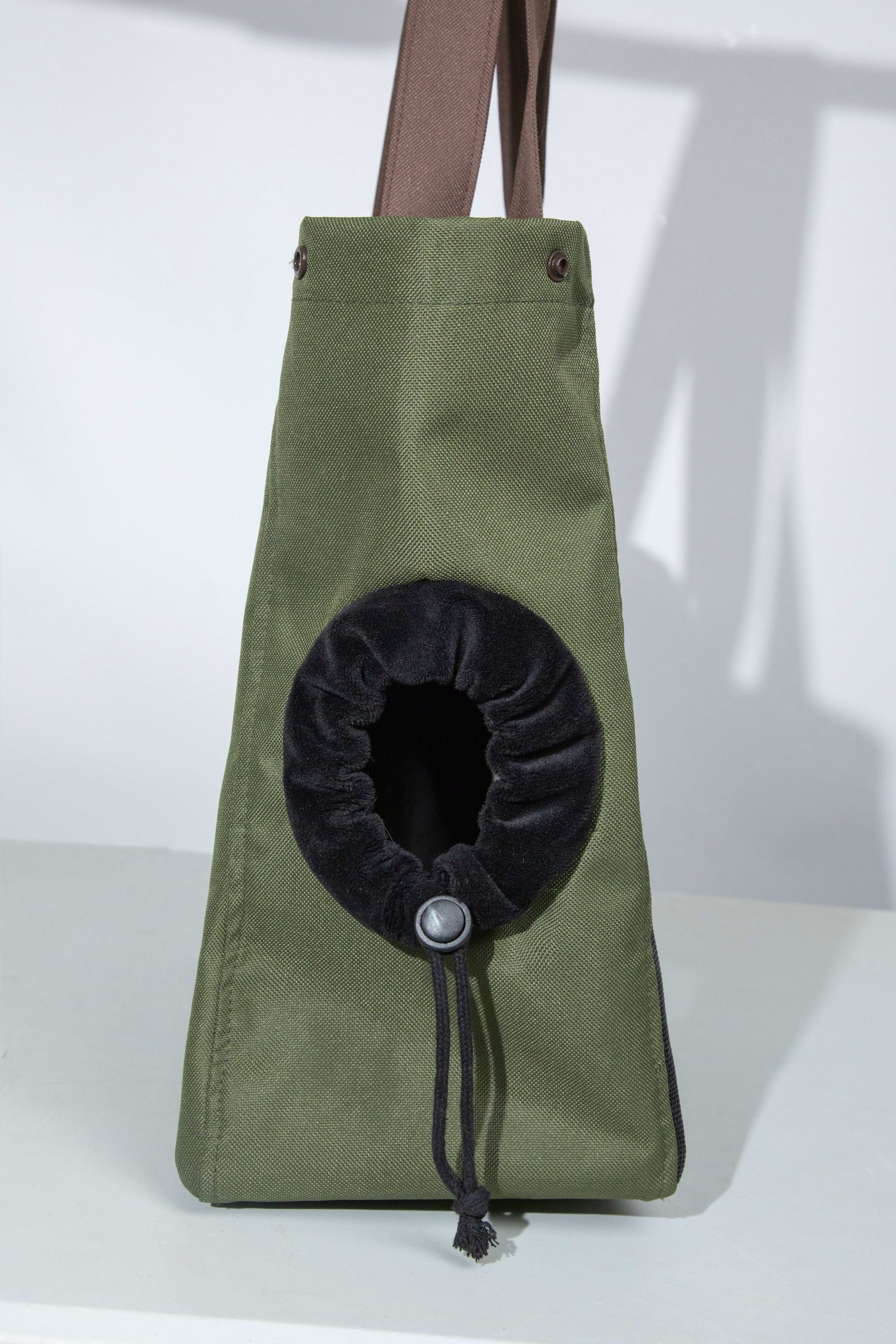 Side view of green HiDREAM Padded Tote Bag with adjustable drawstring opening, designed for secure and breathable pet transport.