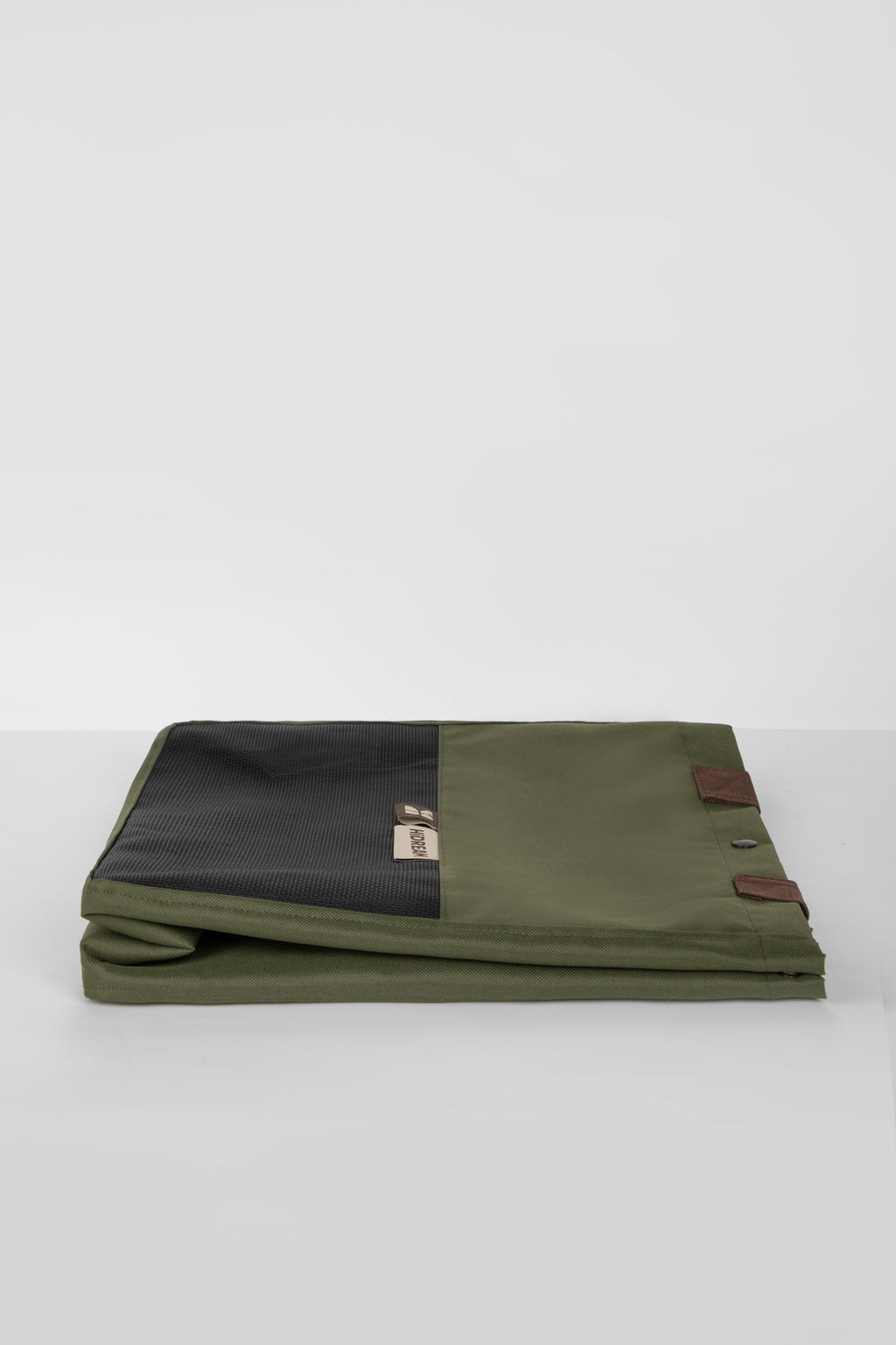 Folded green HiDREAM Padded Tote Bag showing its compact, space-saving design for convenient storage and travel use.