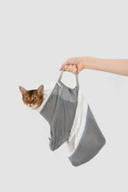 HiDREAM Cat Bathing Bag held by handle with cat inside, showing portable and secure design for Aussie pet care.