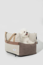 HiDREAM Dog & Cat Car Safety Seat with fluffy white dog lounging inside. Soft, comfy pet travel bed for safe car rides.