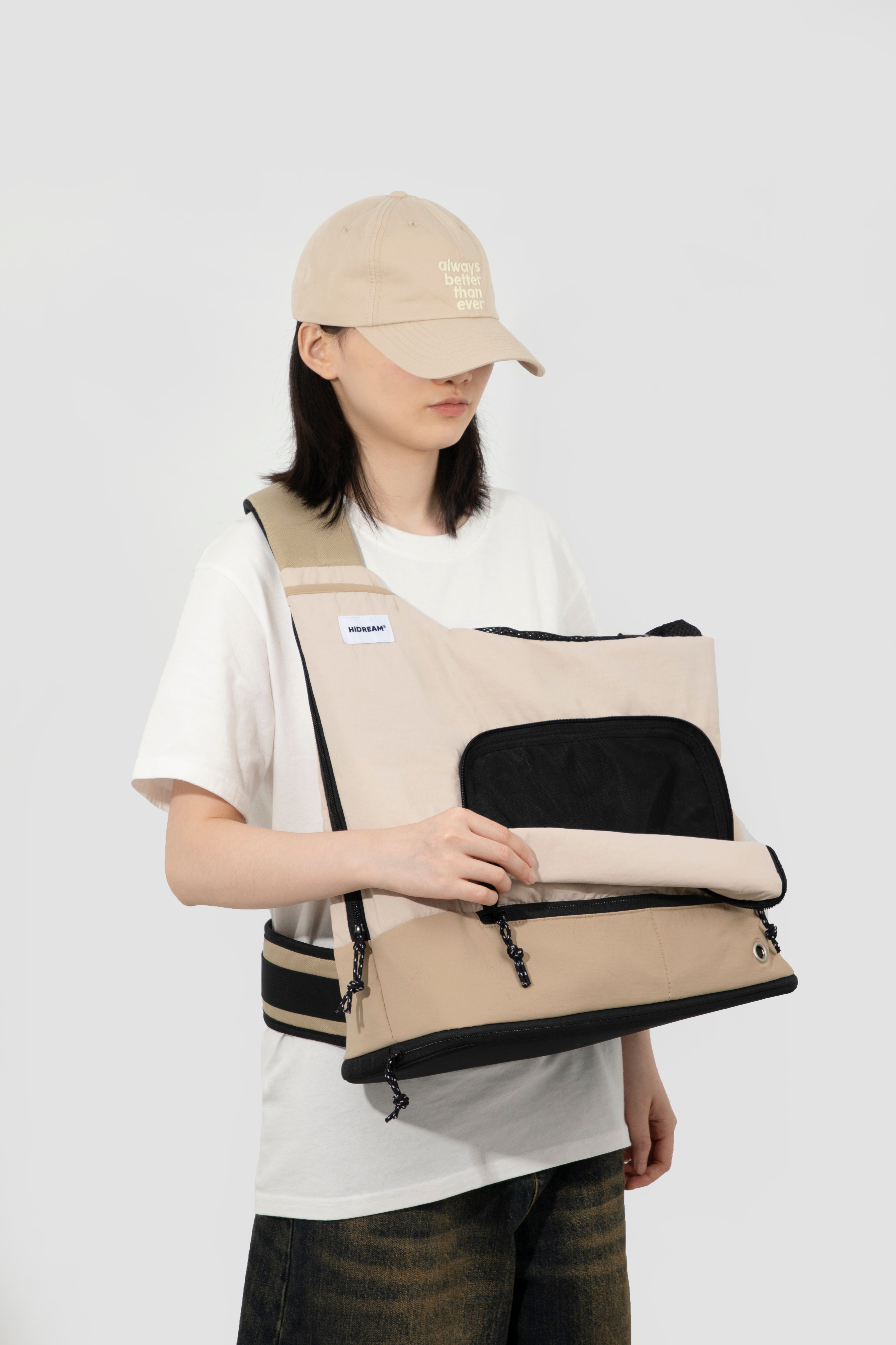 HiDREAM beige Crossbody Travel Bag for Pets shown open, highlighting spacious interior and easy-access front flap.