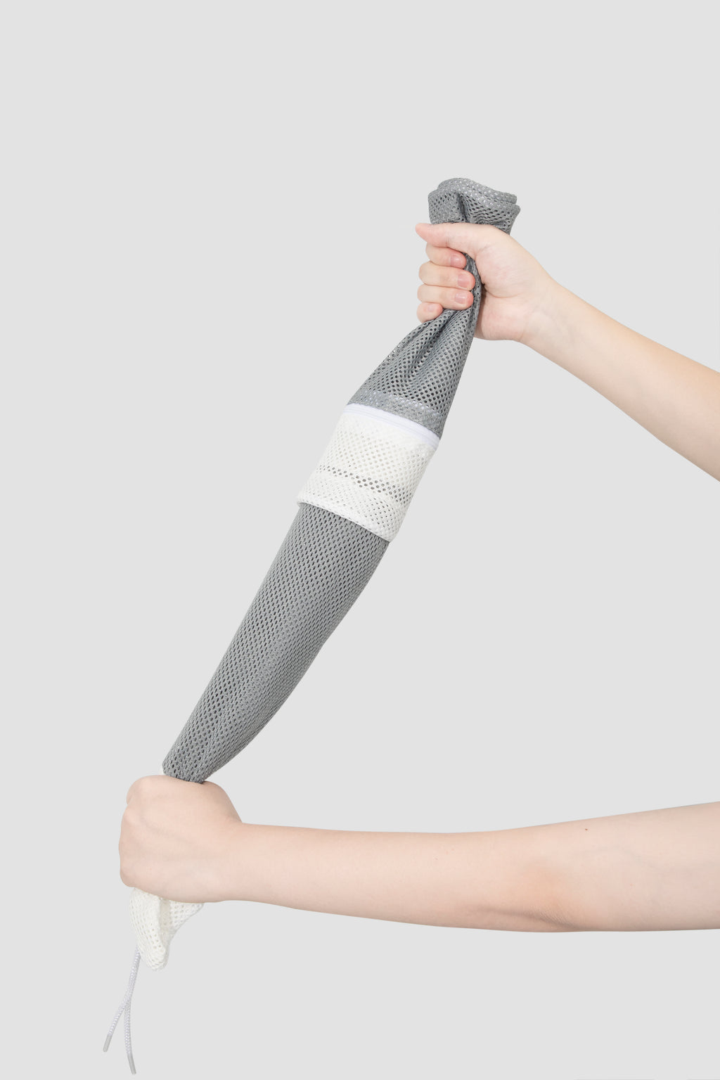 HiDREAM Cat Bathing Bag rolled up to demonstrate compact storage and flexible mesh material.