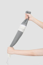 HiDREAM Cat Bathing Bag rolled up to demonstrate compact storage and flexible mesh material.