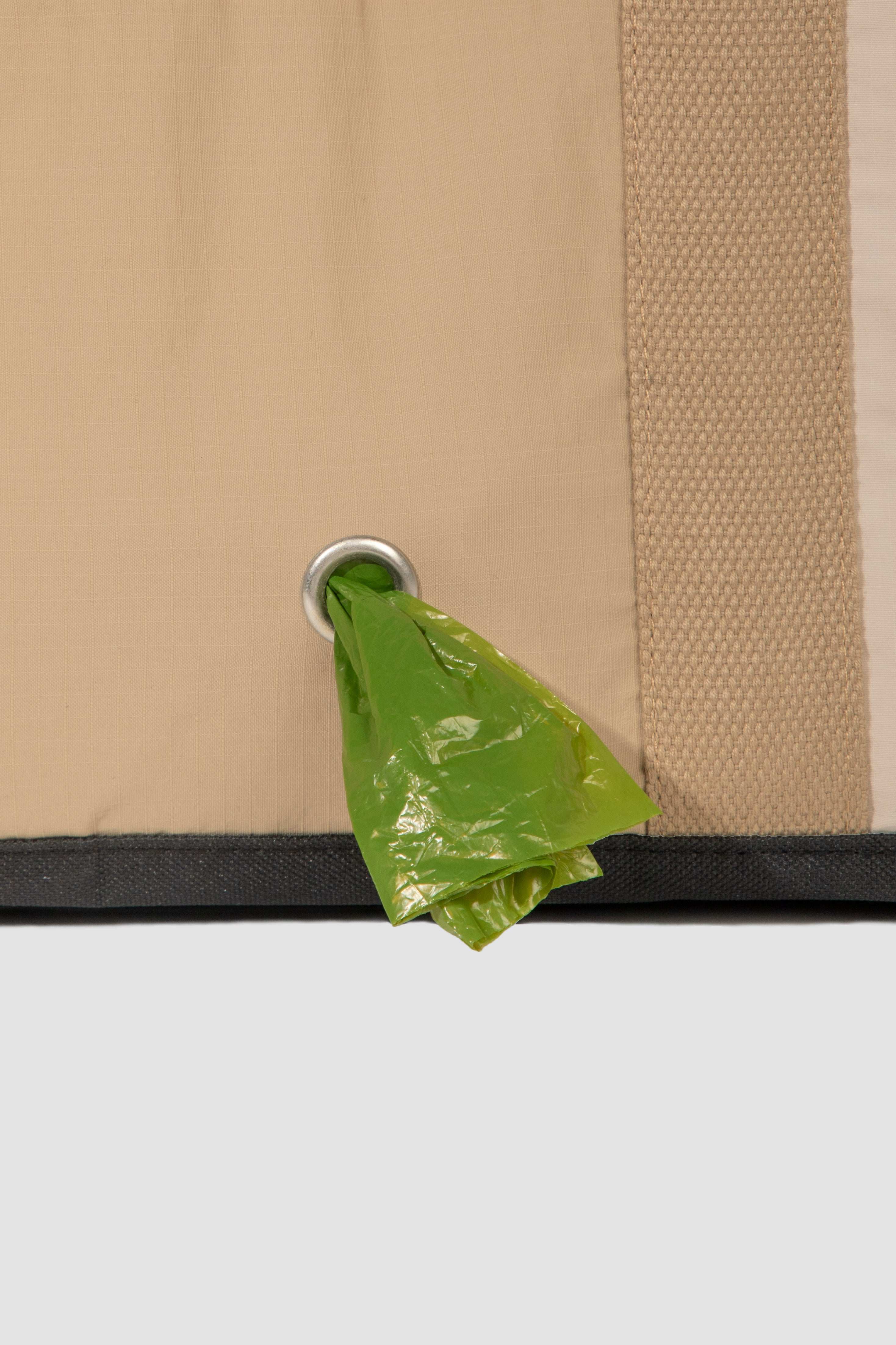 Green waste bag dispenser built into HiDREAM Sling Pet Carrier. Functional detail of the 3-in-1 papoose bag for stylish pet travel in Australia.