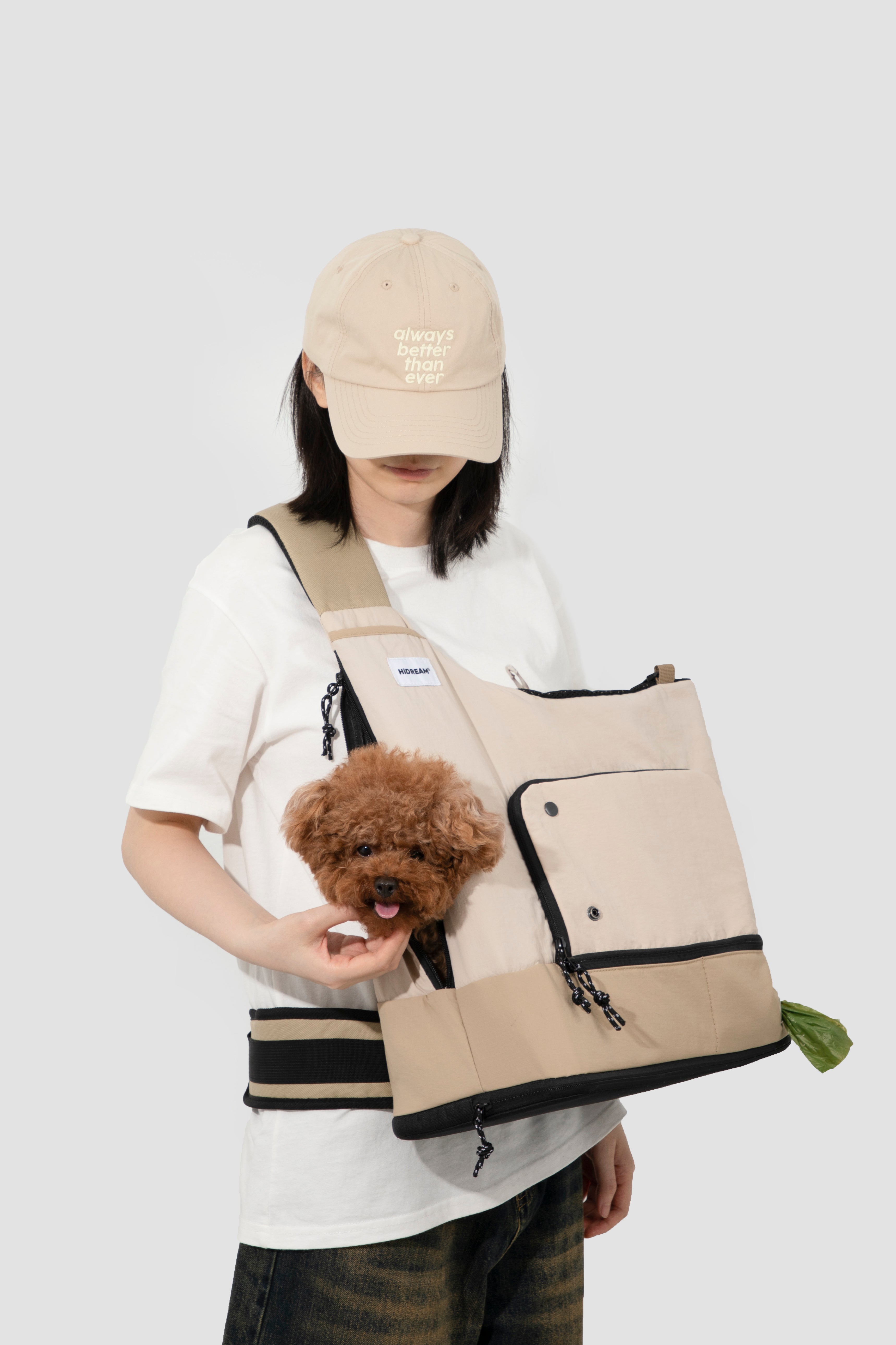 Woman with a dog in beige HiDREAM Crossbody Travel Bag for Pets, showcasing front pocket and secure pet fit.