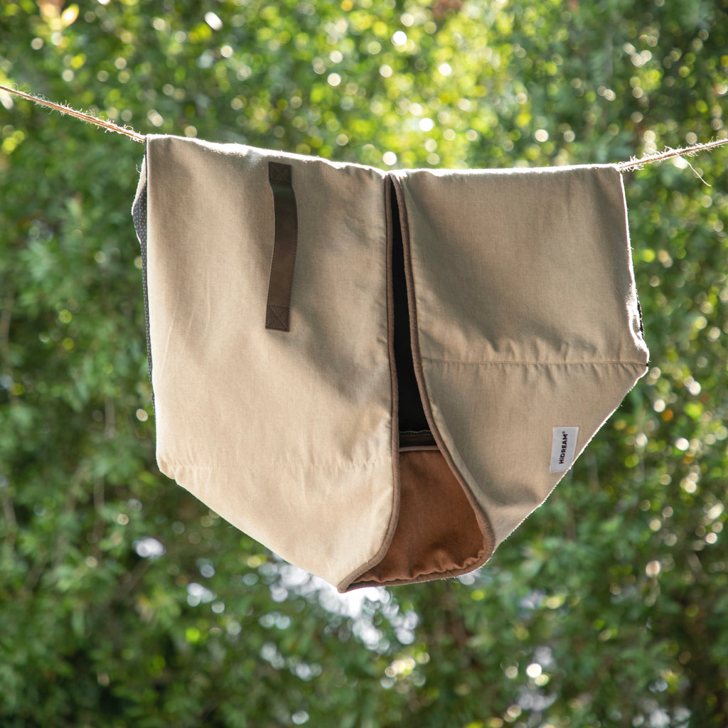 HiDREAM Four-Season Pet Bed cover hanging outdoors. Durable, washable fabric ideal for easy maintenance and long-term use.