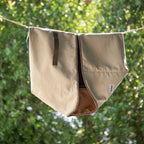 HiDREAM Four-Season Pet Bed cover hanging outdoors. Durable, washable fabric ideal for easy maintenance and long-term use.