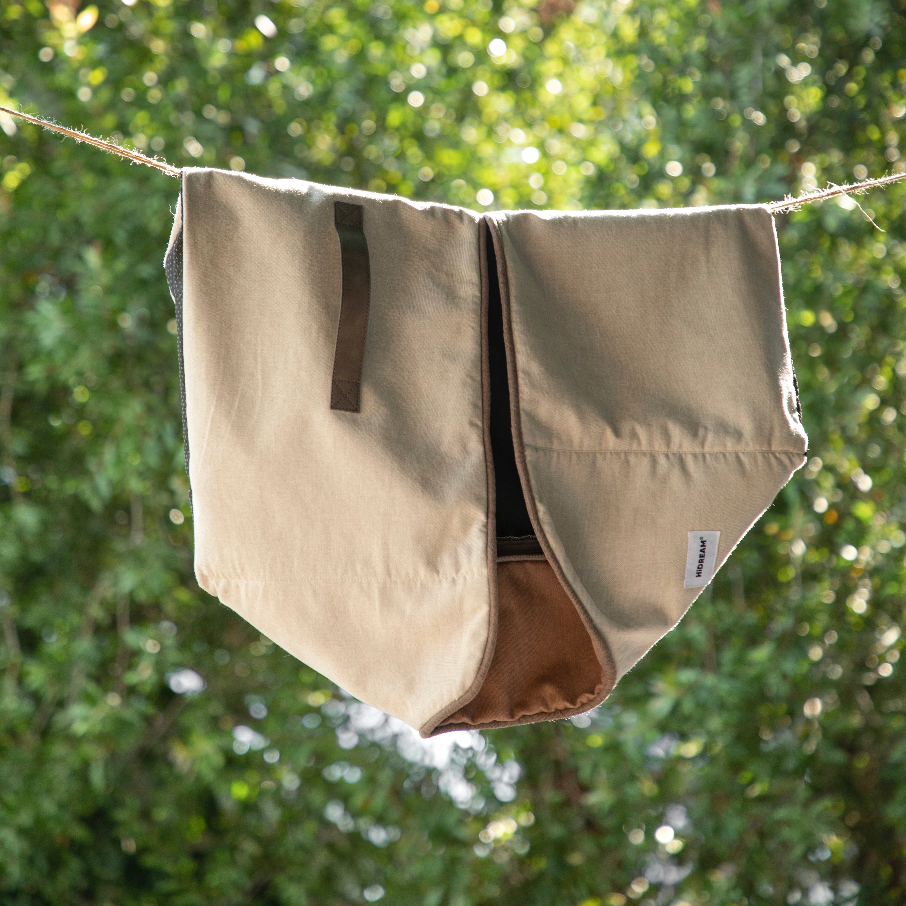 HiDREAM Four-Season Pet Bed cover hanging outdoors. Durable, washable fabric ideal for easy maintenance and long-term use.