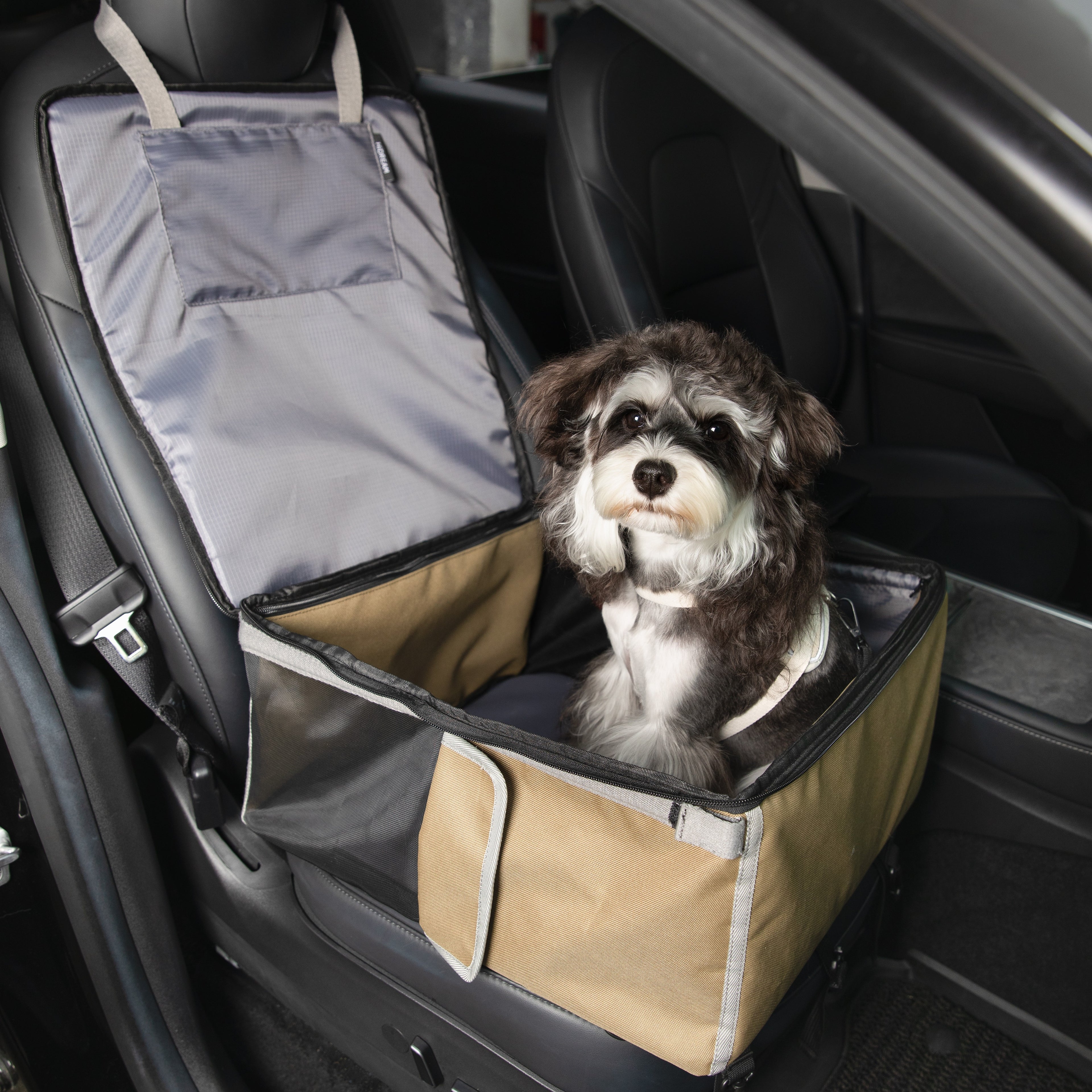 HiDREAM Pet Car Seat Backpack – Dual Use Carrier for Small Dogs & Cats installed in a car, providing a safe and cozy space for pet travel.