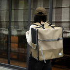 Person wearing HiDREAM Pet Car Seat Backpack – Dual Use Carrier as a backpack, showing its hands-free convenience for pet owners on the go.