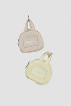Beige and yellow HiDREAM Dog Poop Bag Holders with clip-on handles, stylish and functional for pet waste disposal.