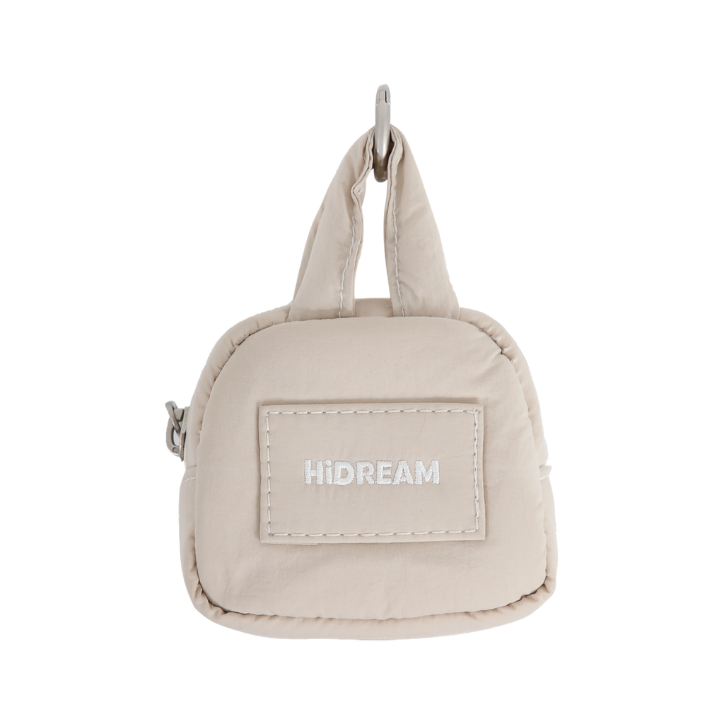 HiDREAM Dog Poop Bag Holder in beige with hands-free clip and compact design for easy pet waste management on walks.