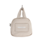 HiDREAM Dog Poop Bag Holder in beige with hands-free clip and compact design for easy pet waste management on walks.
