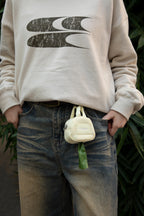 HiDREAM Dog Poop Bag Holder clipped to jeans belt loop, offering hands-free and stylish pet waste solution.