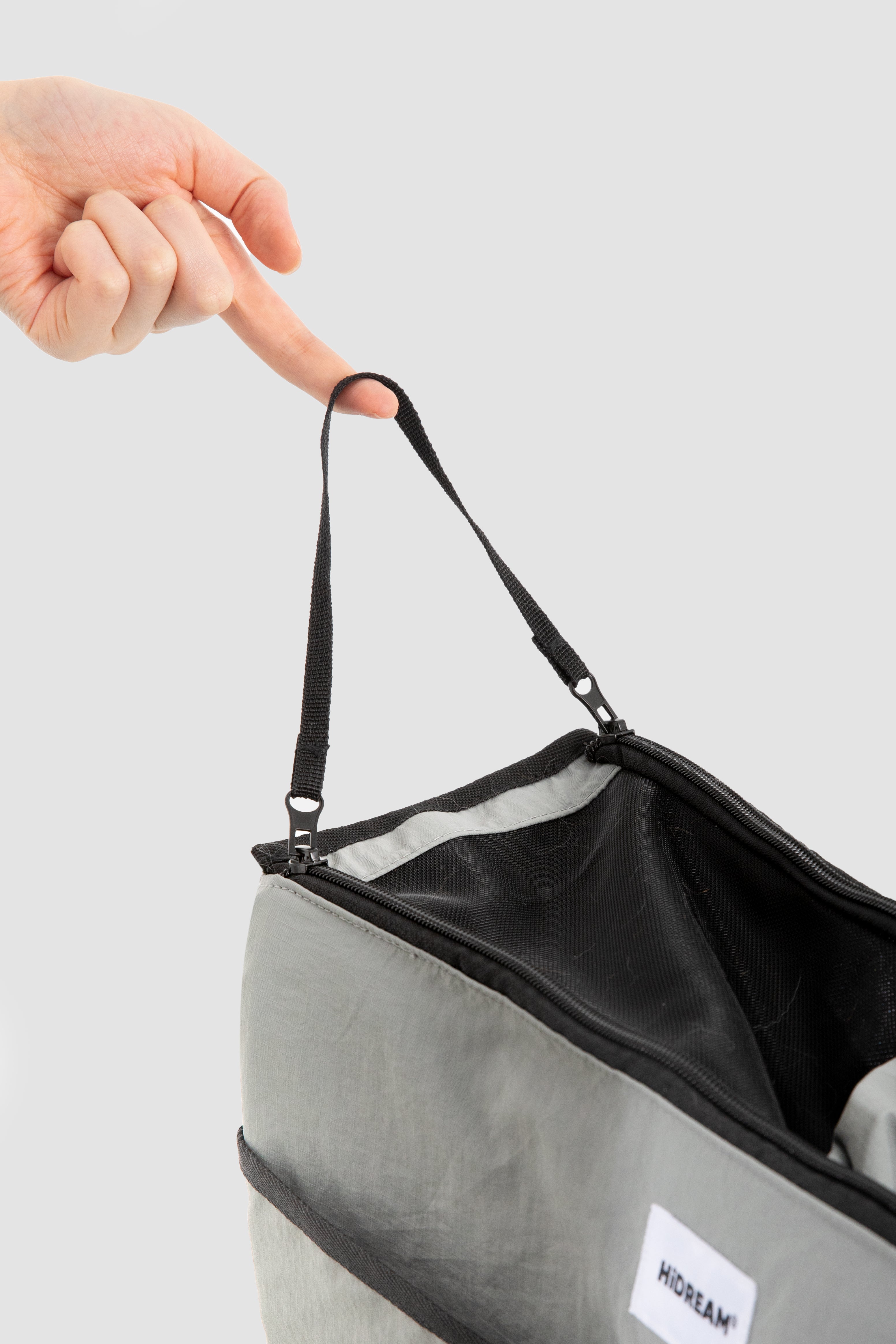 Safety tether loop inside HiDREAM Crossbody Pet Carrier Tote. Prevents pets from jumping out during transport.