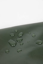 Close-up of water droplets on green HiDREAM Padded Tote Bag, highlighting its water-resistant material for pet safety and durability.