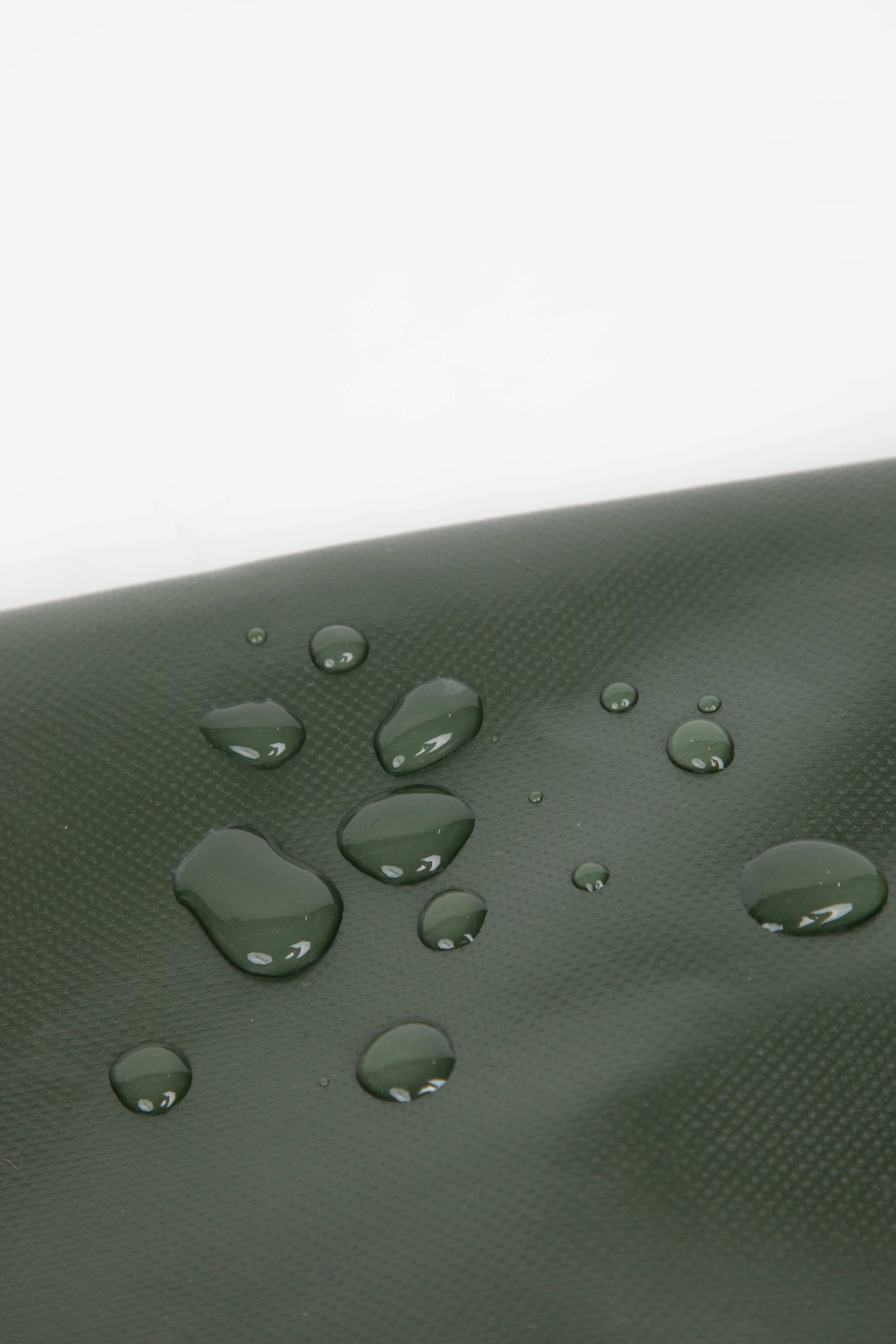 Close-up of water droplets on green HiDREAM Padded Tote Bag, highlighting its water-resistant material for pet safety and durability.
