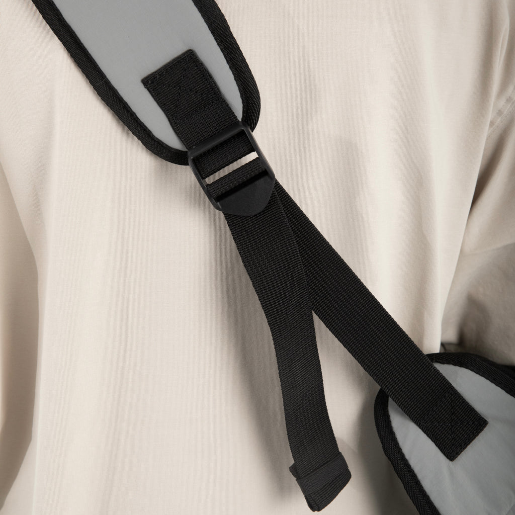 Adjustable strap detail on HiDREAM Crossbody Pet Carrier Tote. Ensures a secure and customized fit for pet owners.