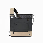 HiDREAM Crossbody Travel Bag for Pets in black and beige, soft-sided carrier with secure mesh closure and side ventilation hole.