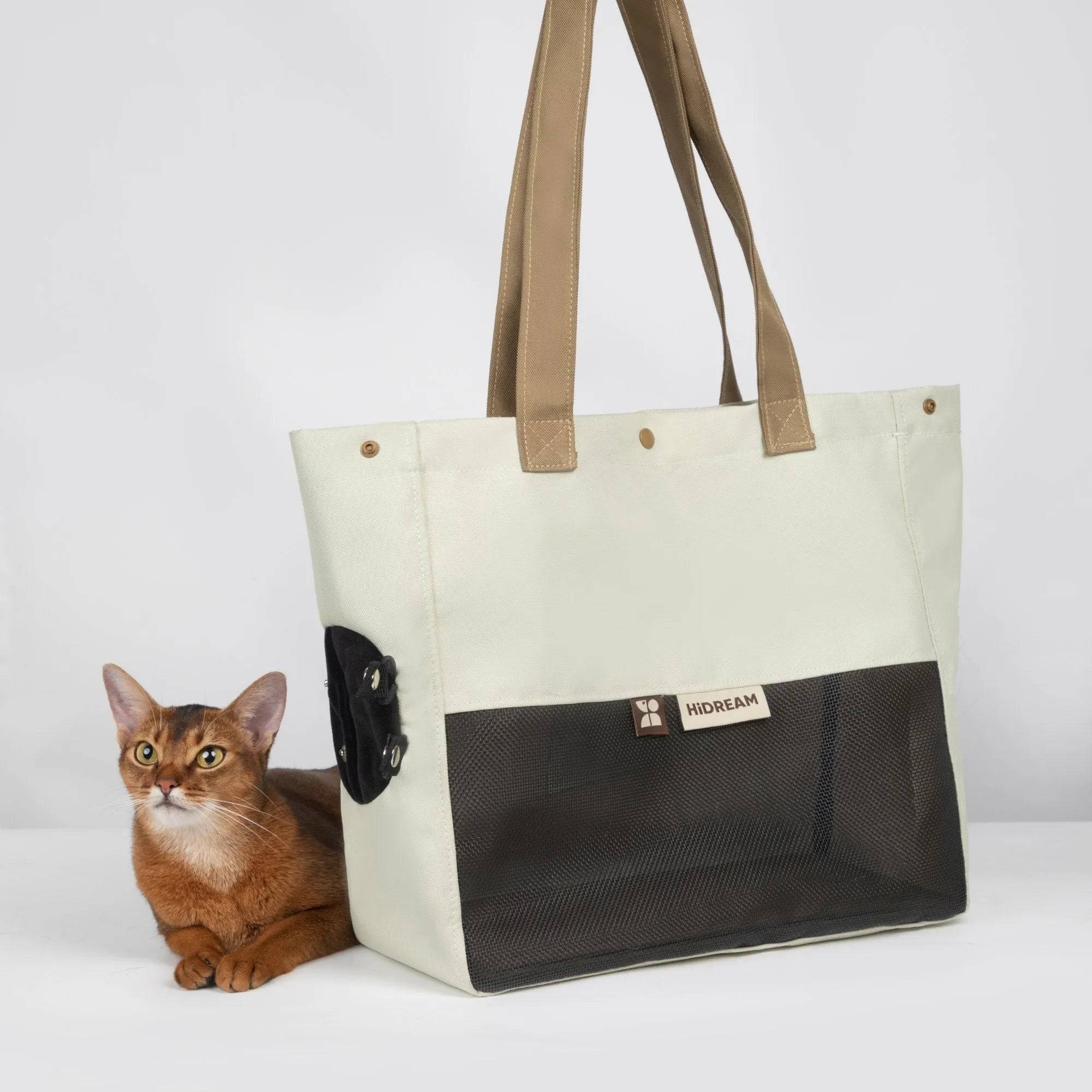 Cream HiDREAM Padded Tote Bag beside a cat, showcasing its stylish and breathable design for everyday pet outings and travel.