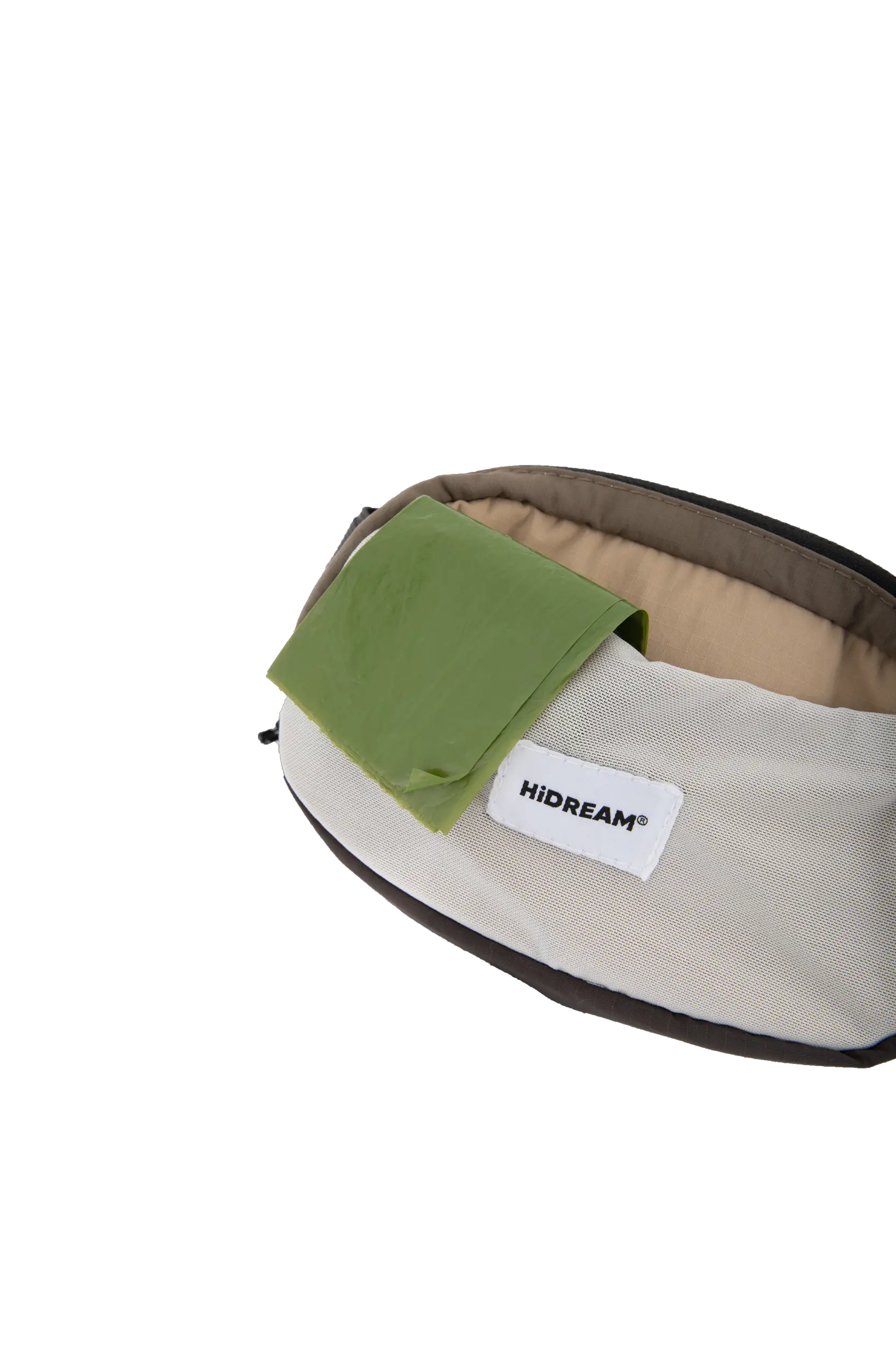 Dog waste bag stored in the flexible front pocket of the waist bag