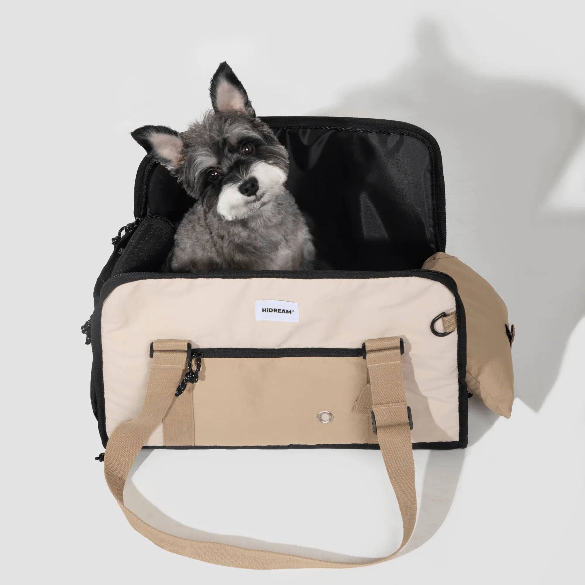 Small dog sitting inside HiDREAM Semi-open Papoose Bag, a 3-in-1 sling carrier for stylish pet travel in Australia. Ideal for hands-free transport.