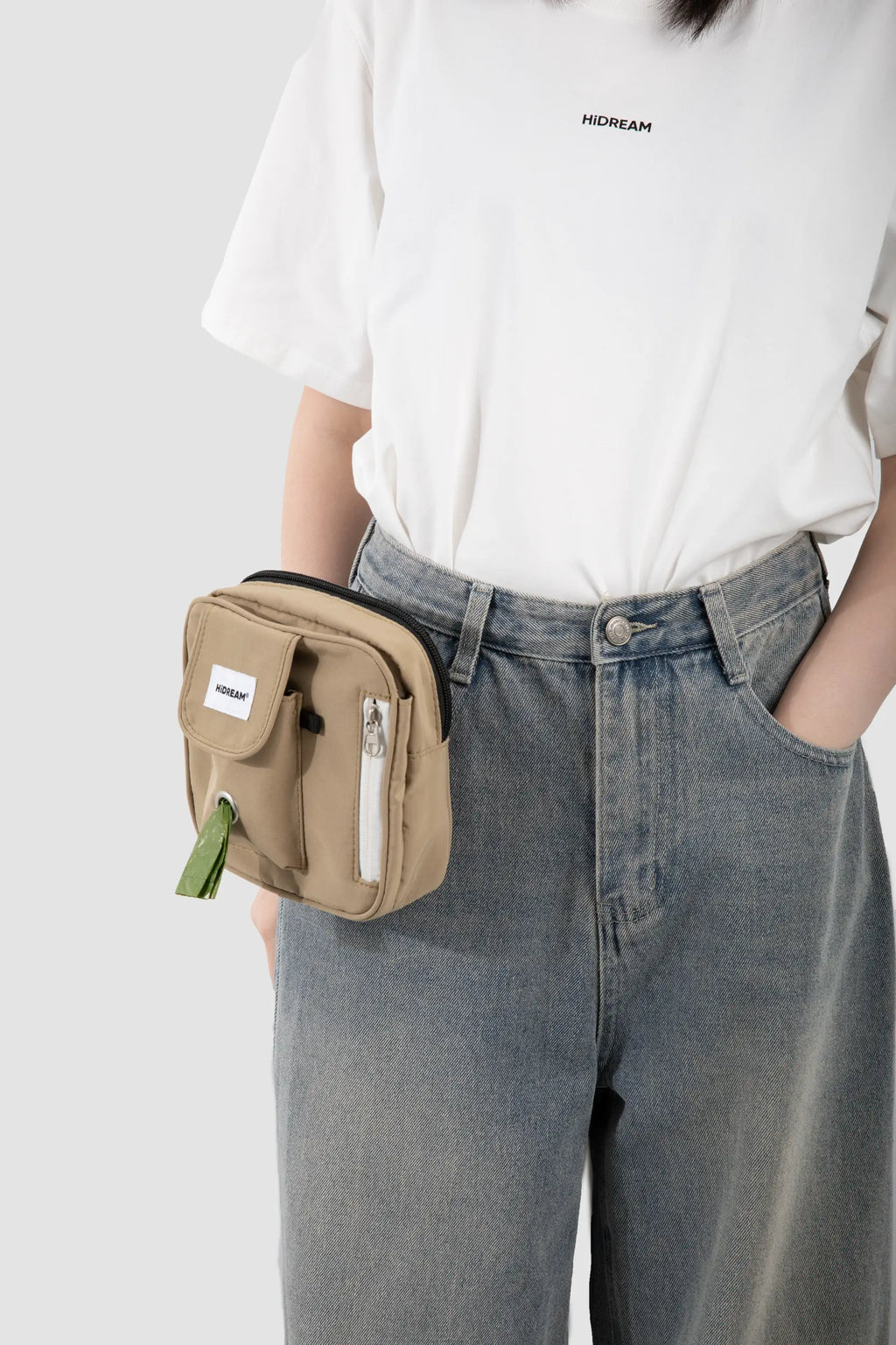 HiDREAM Toast dog treat pouch clipped to jeans at the waist