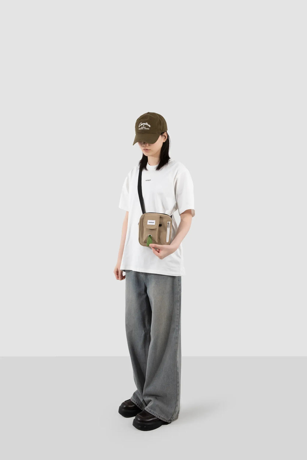 Terracotta Brown dog treat pouch worn crossbody with an adjustable strap